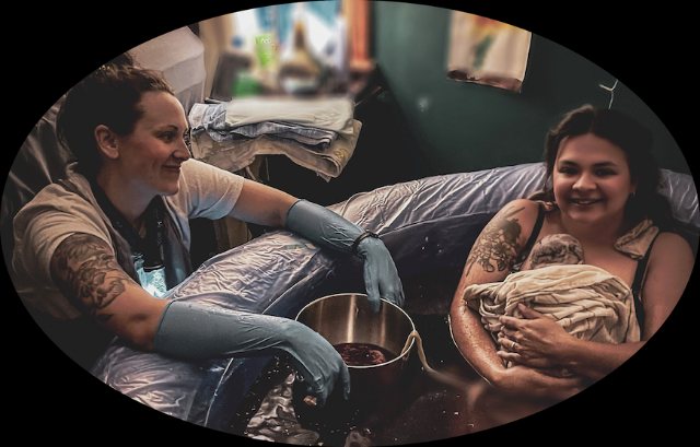 A midwife supporting a parent and newborn during a water birth